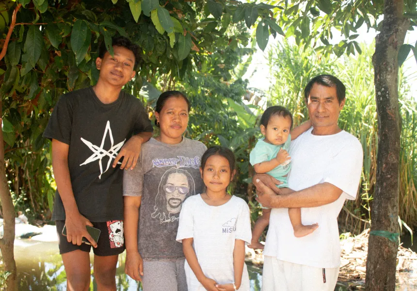 A scholarship student's family together at home in Bali.