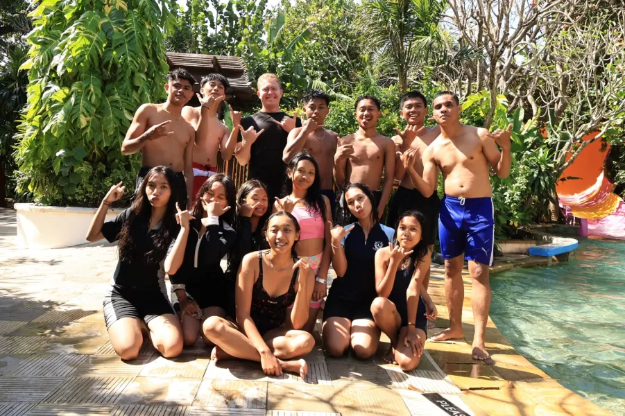 Scholarship students posing together poolside at Waterbom Bali.